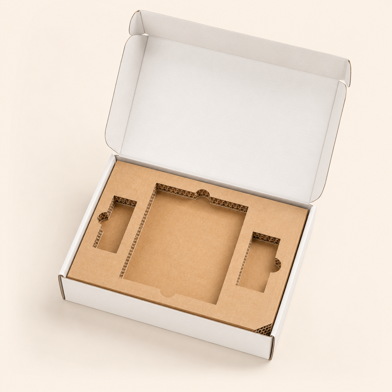 Open mailer box with fitted die-cut corrugated inserts and visible fluted edges.