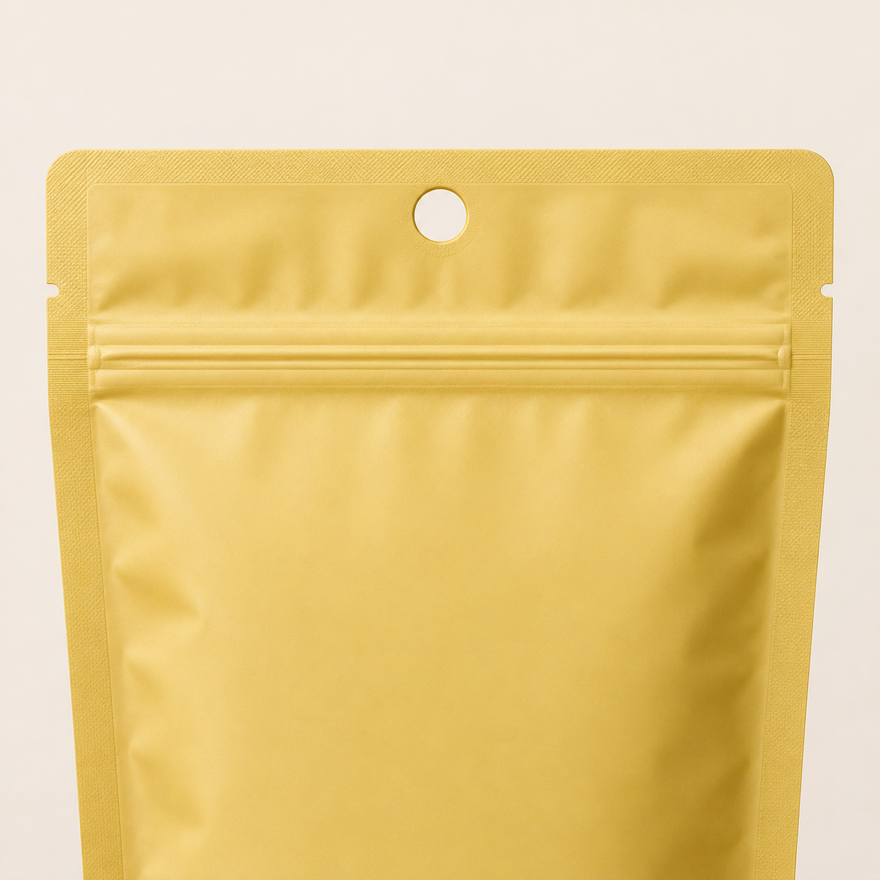 Mylar pouch with a reinforced round hang hole above the zipper.