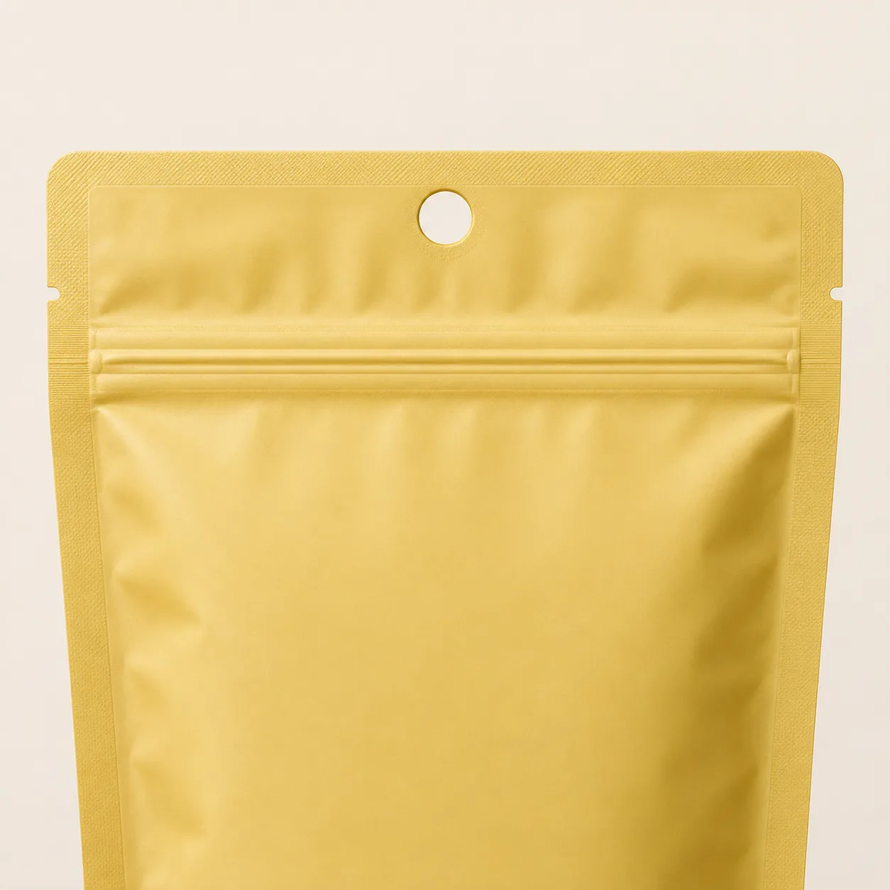 Mylar pouch with a reinforced round hang hole above the zipper.