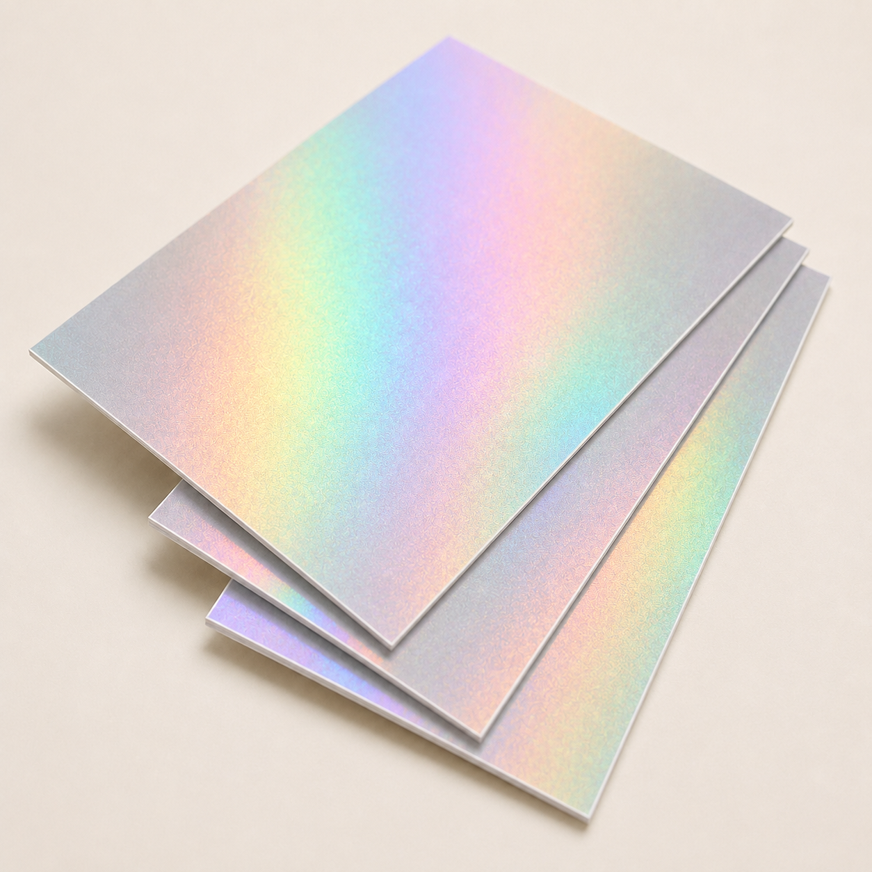 Thin holographic cardstock sheets with a rainbow-reflective surface.