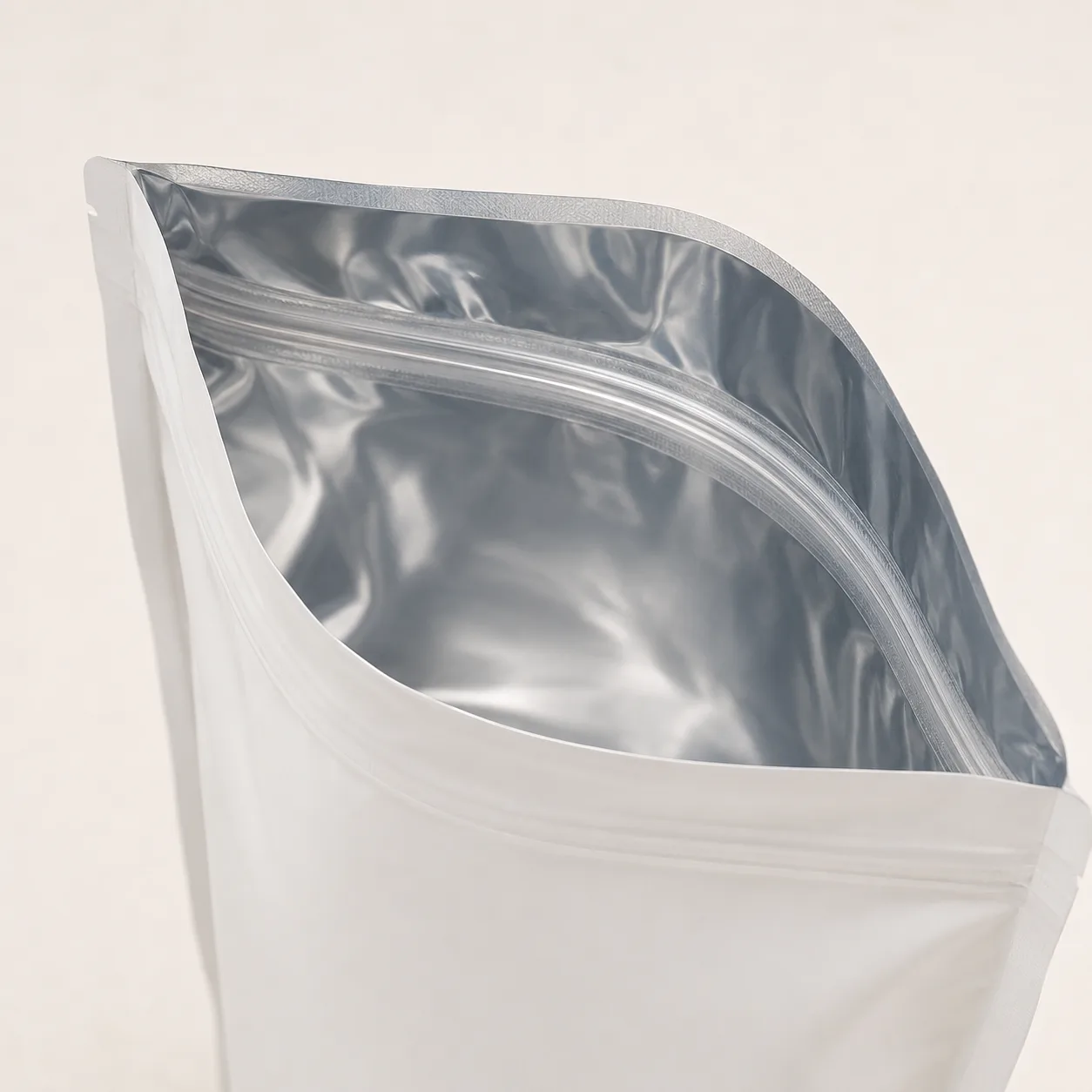 Open Mylar bag showing reflective aluminum foil laminated inside.