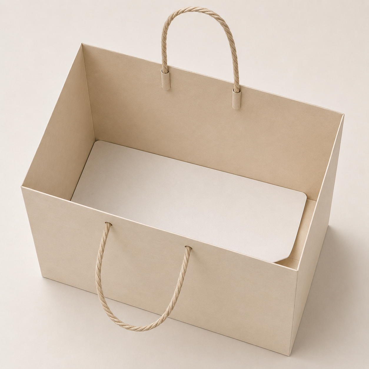 Paper shopping bag with a fitted paperboard insert reinforcing the bottom.