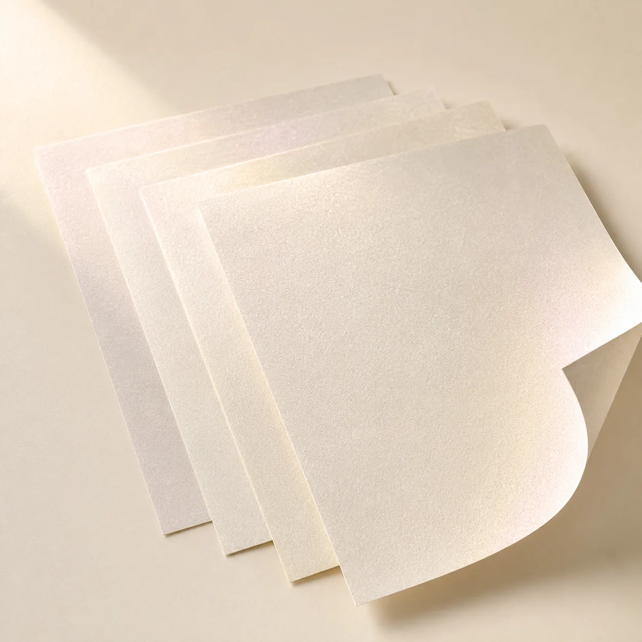 Luminous pearlescent paper sheets for premium rigid box wrapping