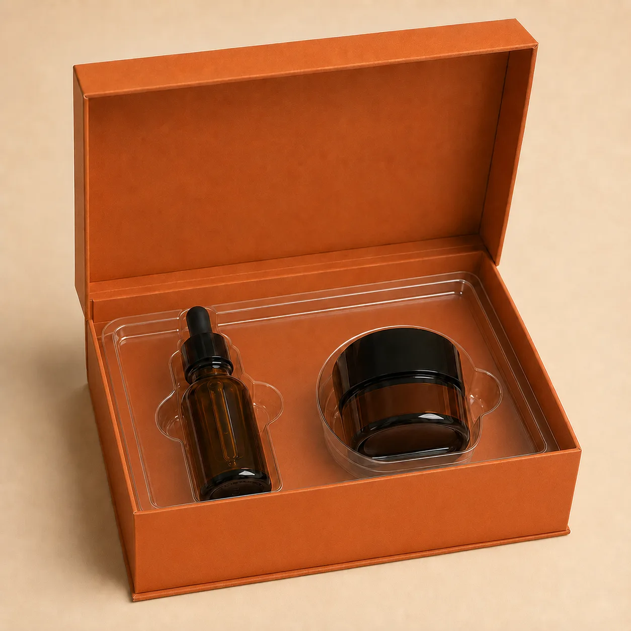 Clear thermoformed plastic insert fitted around two cosmetic products.