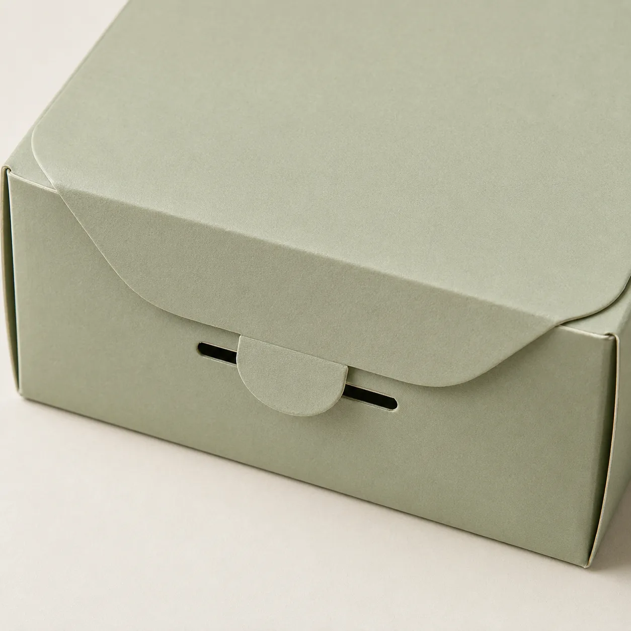 Paperboard box with a locking tab inserted into the front slot.