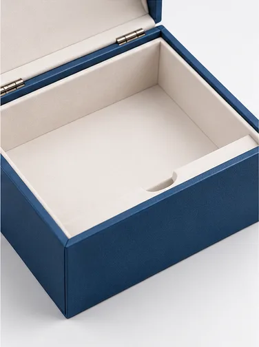 Rigid base of a hinged box showing the compartment that holds the insert and product.
