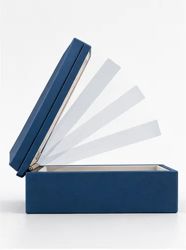 Side view of a hinged rigid box showing the controlled lid opening angle created by the hinge position.