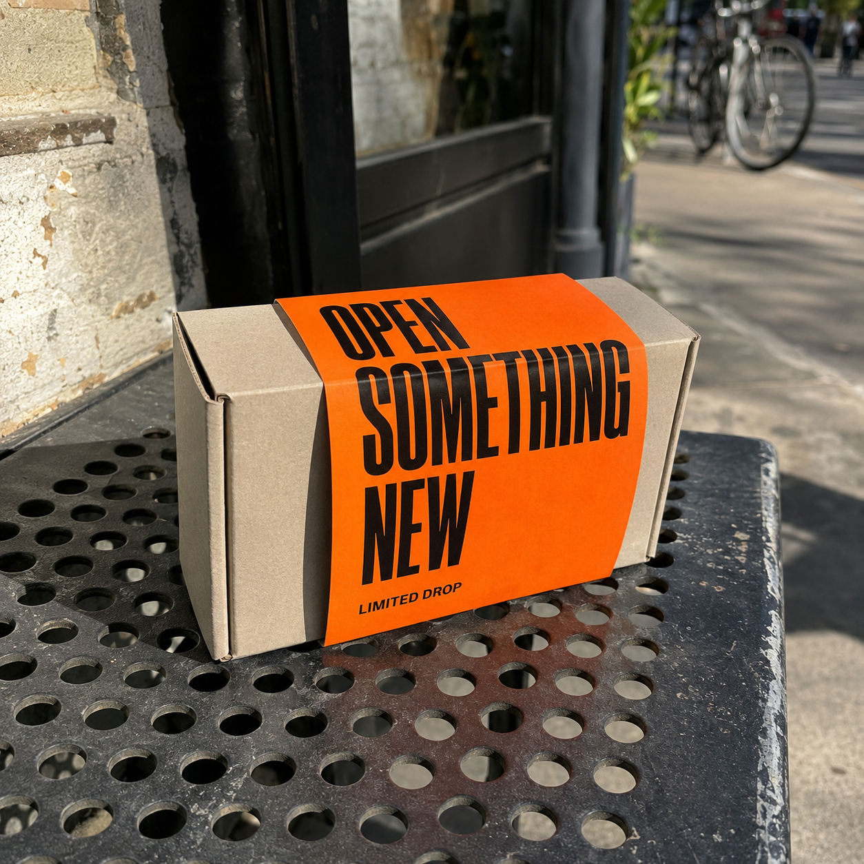 Campaign packaging sleeve wrapped around a mailer box on a table