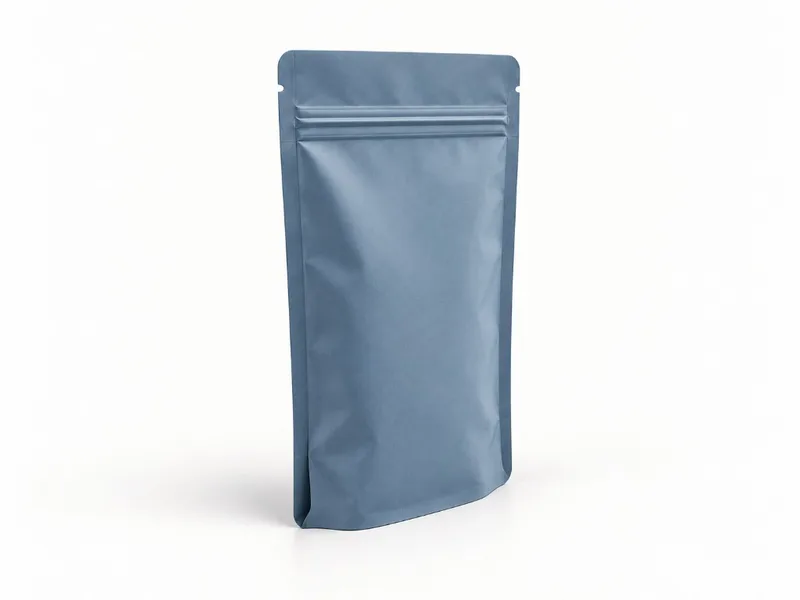 Empty stand up pouch with the bottom gusset folded inward before filling.